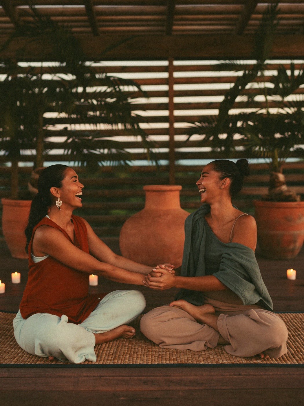 A couple seated together at golden hour, present and at ease